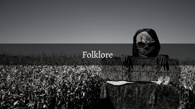 Blog header Folklore 
Text: Folklore
Image: a creepy scarecrow in a field