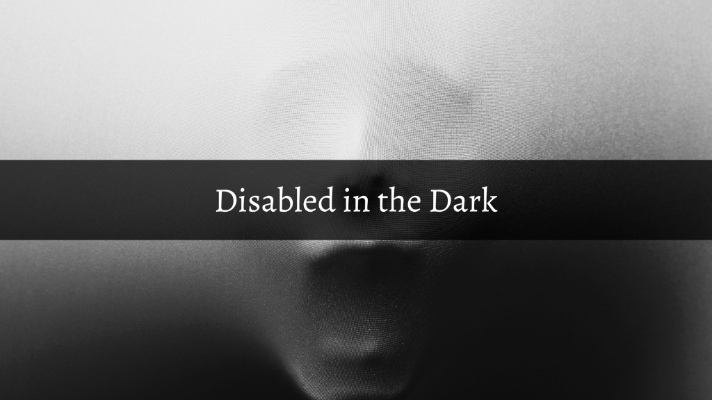 Disabled in the Dark Blog series title over an image of a distressed face coming through a sheet