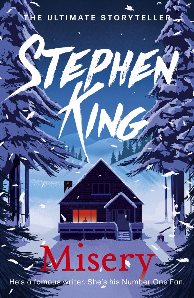 A stylised illustration of a snow-covered cabin surrounded by dark pine trees at dusk. Light glows warmly from a single window where a solitary figure is visible. Snow falls across the scene. Above the cabin, the author’s name “Stephen King” appears in large white brush-stroke lettering. Below, the title Misery is written in red, along with the tagline: “He’s a famous writer. She’s his Number One Fan.”